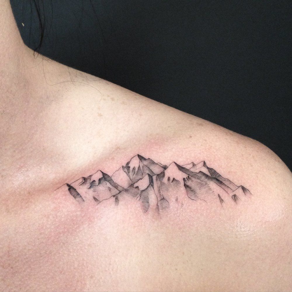 Mountain tattoo on collarbone for women