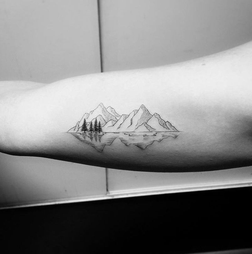 Mountain tattoo on arm for women