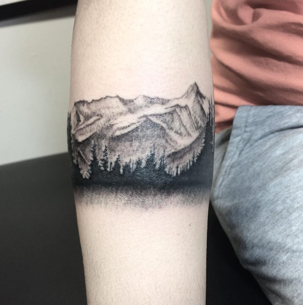 Mountain tattoo on arm for women