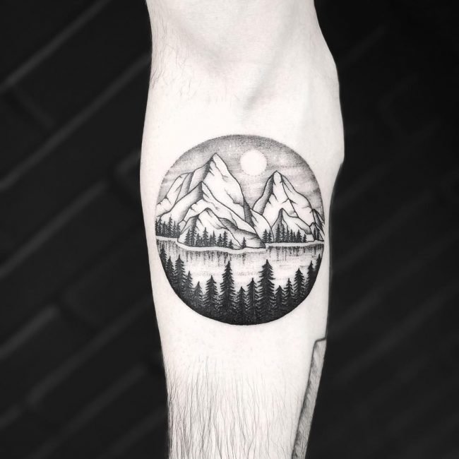 Mountain tattoo on forearm for men