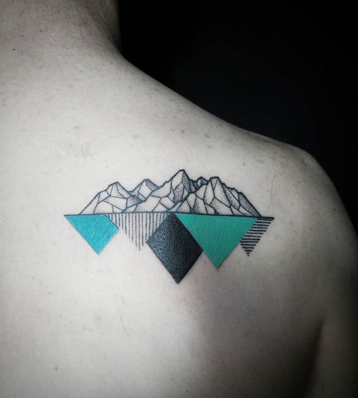 Mountain tattoo on the shoulder blade for men