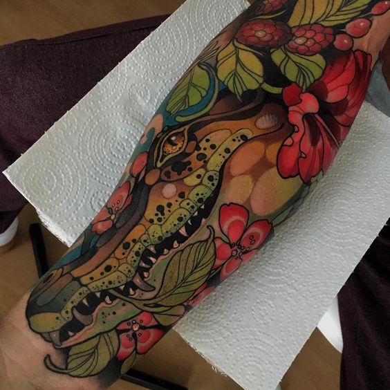 New-school color tattoo on the forearm for men