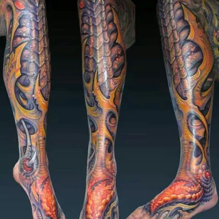 Colorful organic tattoo on the legs for men