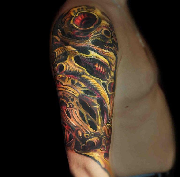 Colorful organic tattoo on the shoulder for men