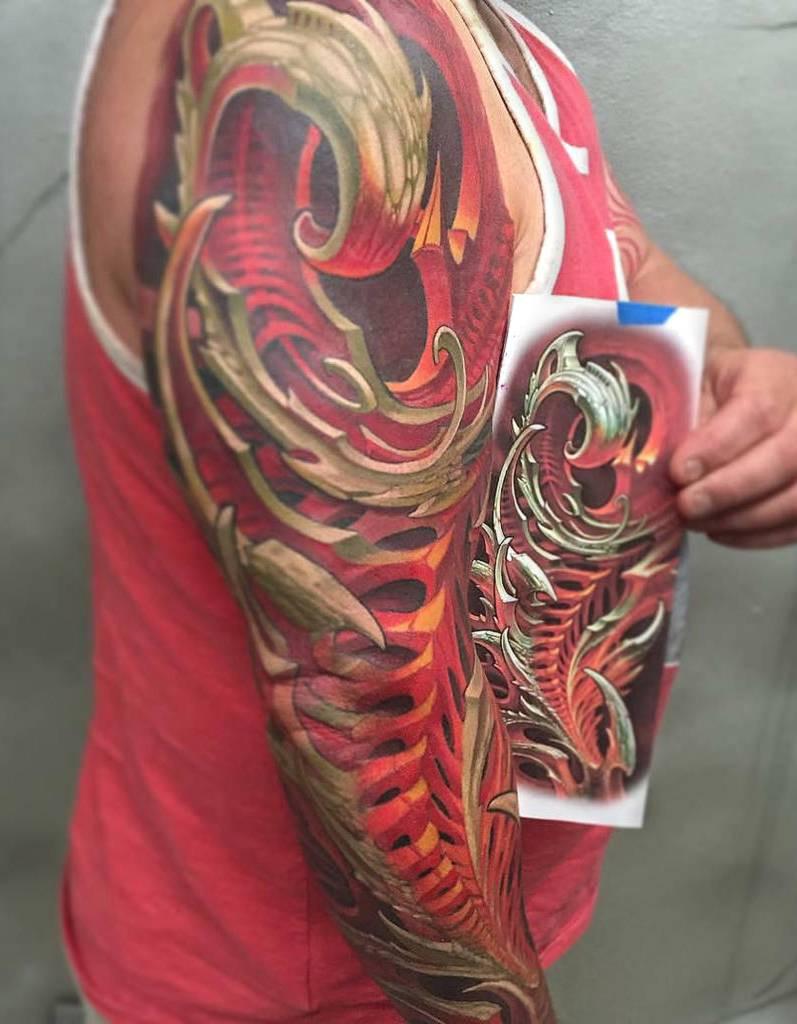 Large organic style tattoo on the arm for men