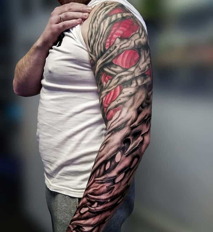 Large organic style tattoo on the arm for men