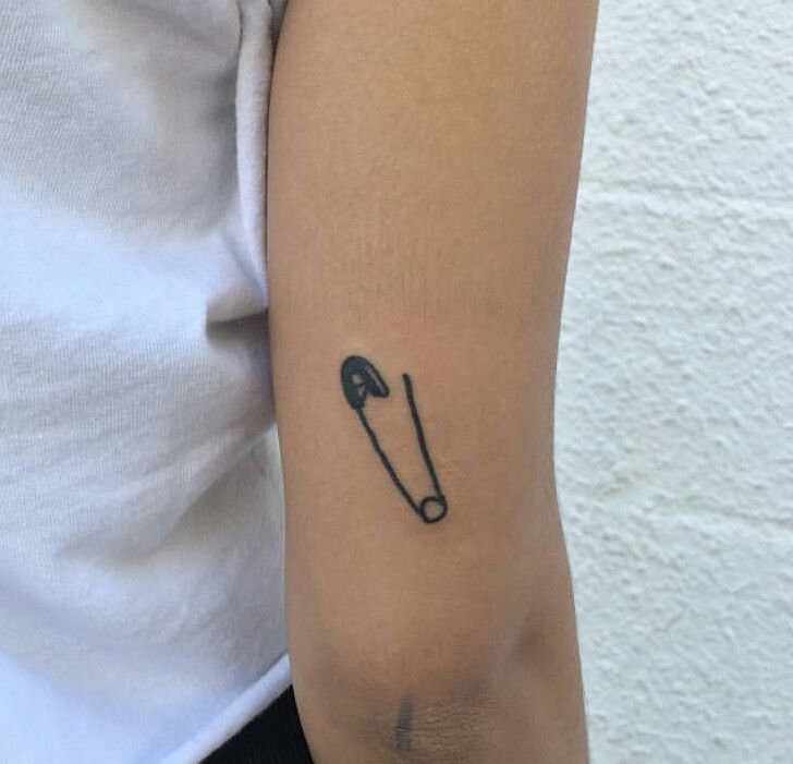 Pin tattoo on the shoulder for men