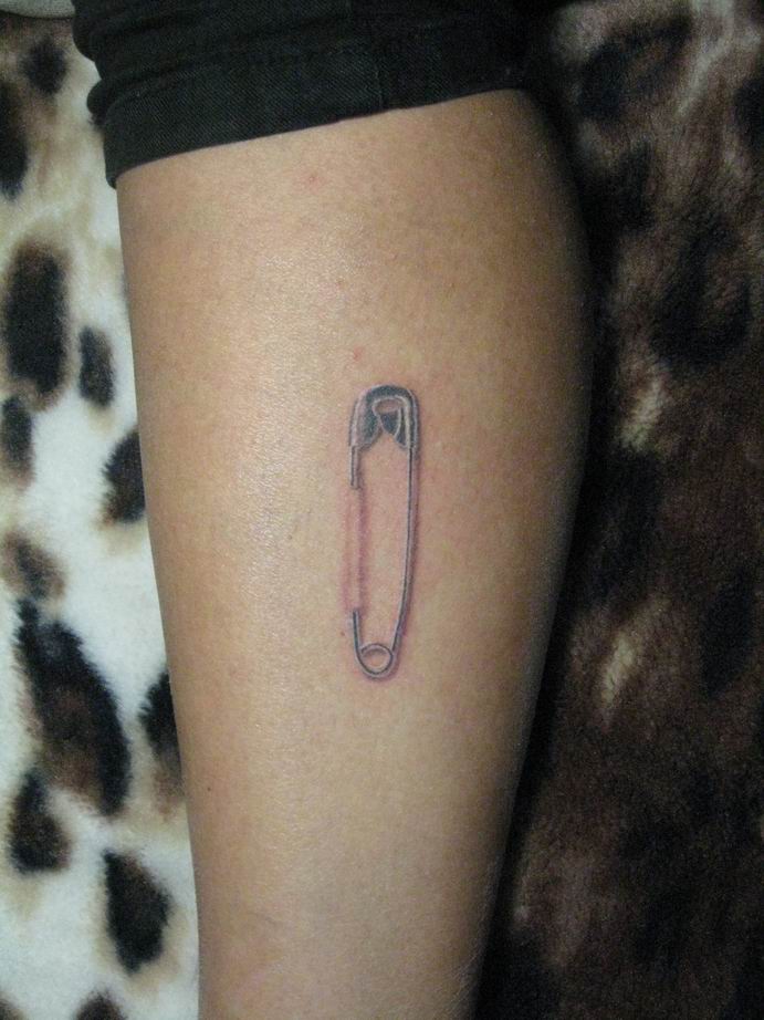 Pin tattoo on leg for men