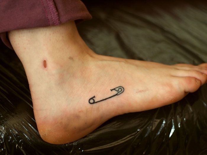 Ankle pin tattoo for men