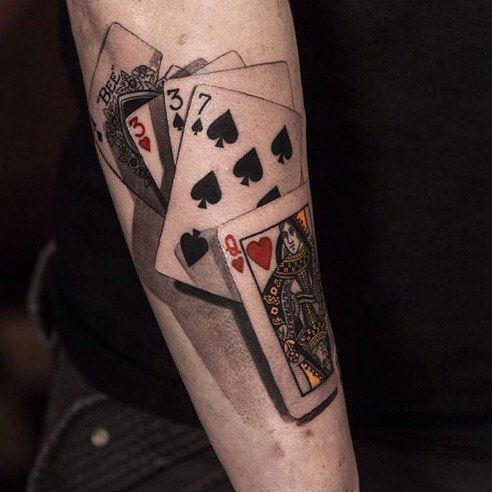 Playing cards tattoo on forearm for women