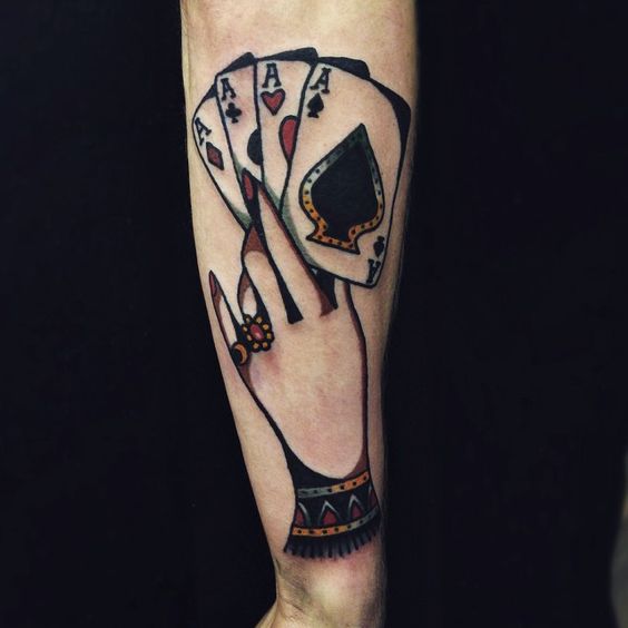 Tattoo of playing cards on the arm for men