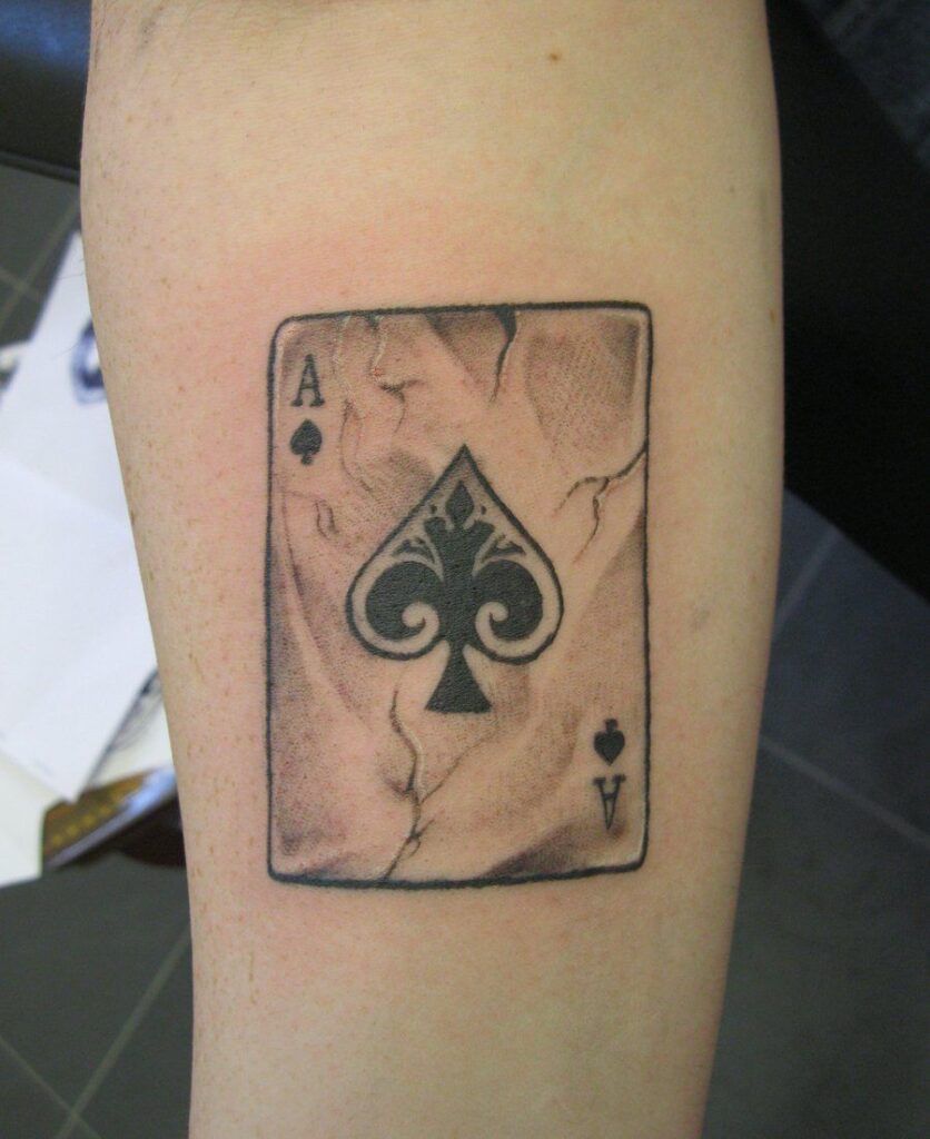 Playing cards tattoo on forearm for men