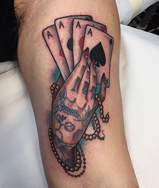 Tattoo of playing cards on the shoulder for men