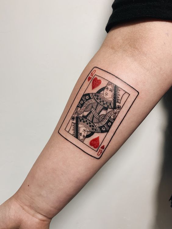 Colored playing cards tattoo on forearm for men