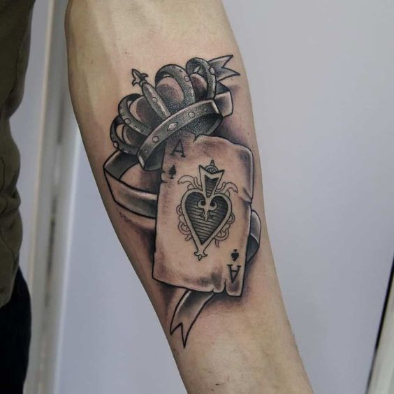 Playing cards tattoo on forearm for men