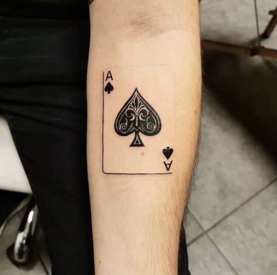 Playing cards tattoo on forearm for men