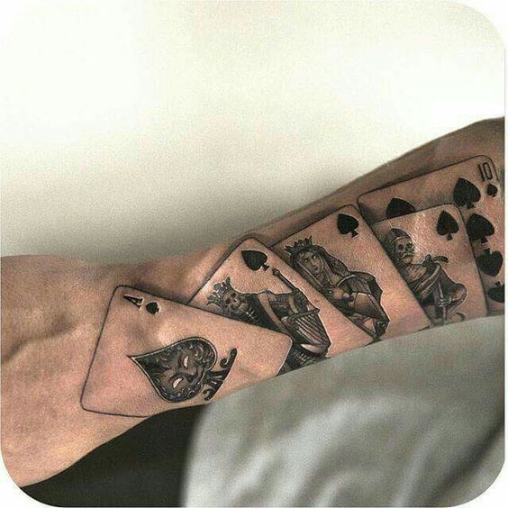 Playing cards tattoo on forearm for men