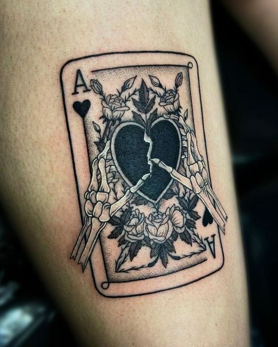 Tattoo of playing cards on the shin for men