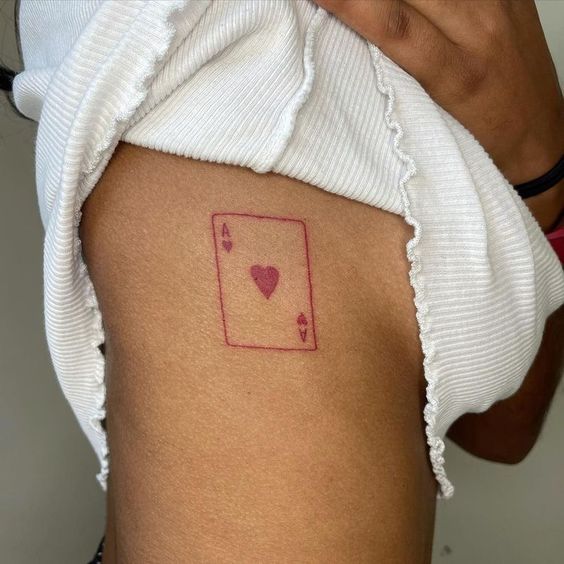 Playing cards tattoo on the side for women