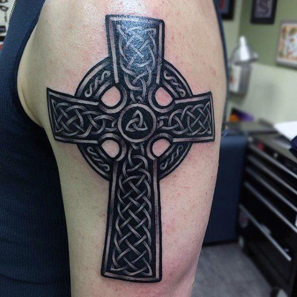 Celtic cross tattoo on shoulder for men