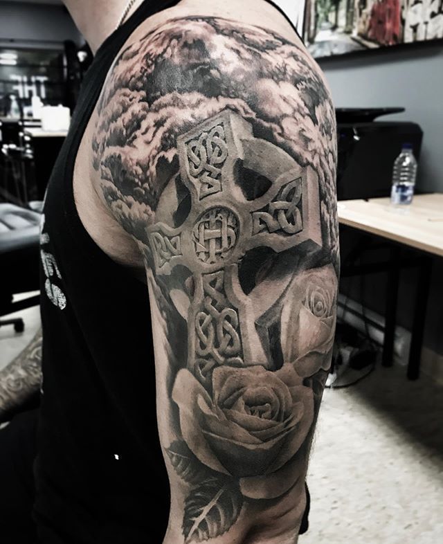 Celtic cross tattoo on shoulder for men