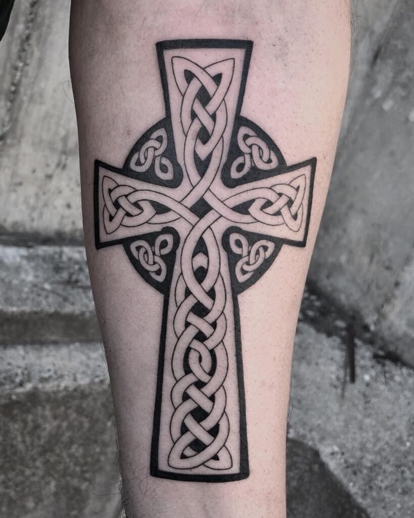 Celtic cross tattoo on arm for men