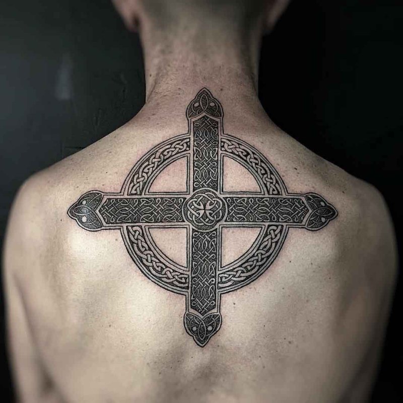 Celtic cross tattoo on back for men