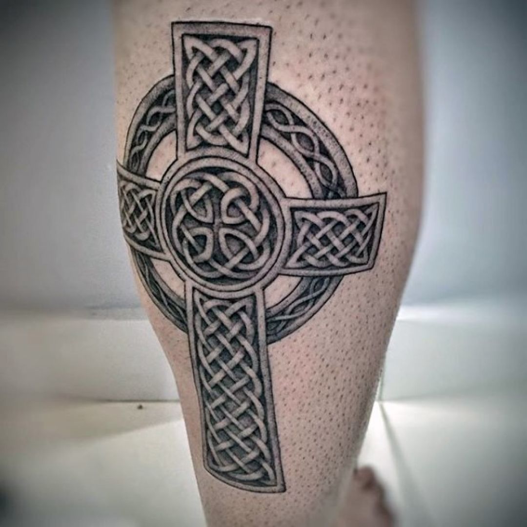 Celtic cross tattoo on calf for men