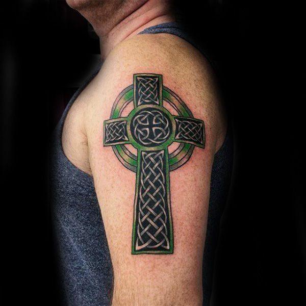 Celtic cross tattoo on shoulder for men