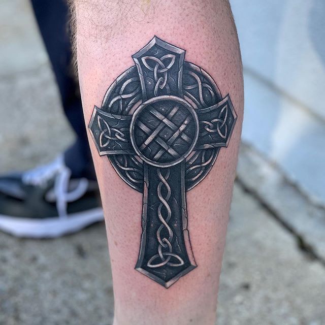 Celtic cross tattoo on shin for men