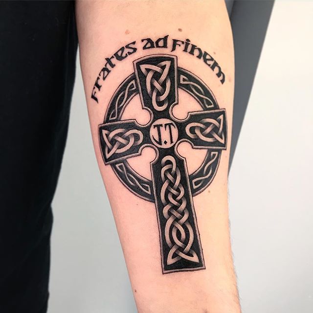 Celtic cross tattoo on arm for men