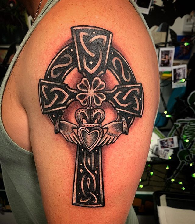 Celtic cross tattoo on shoulder for men