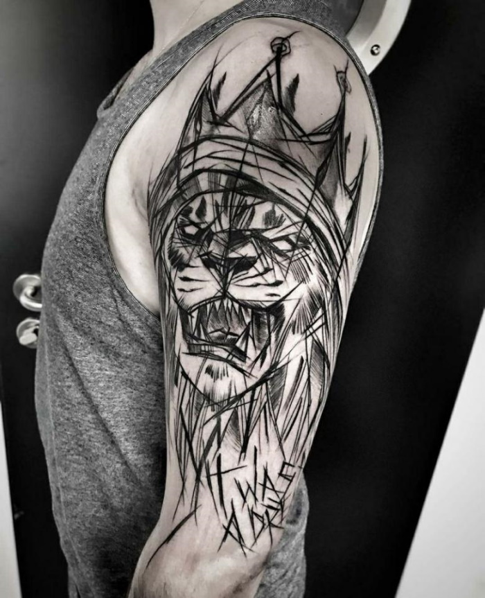 Sketch style lion tattoo on the shoulder for men