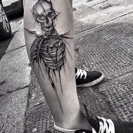 Sketch style skeleton tattoo on shin for men