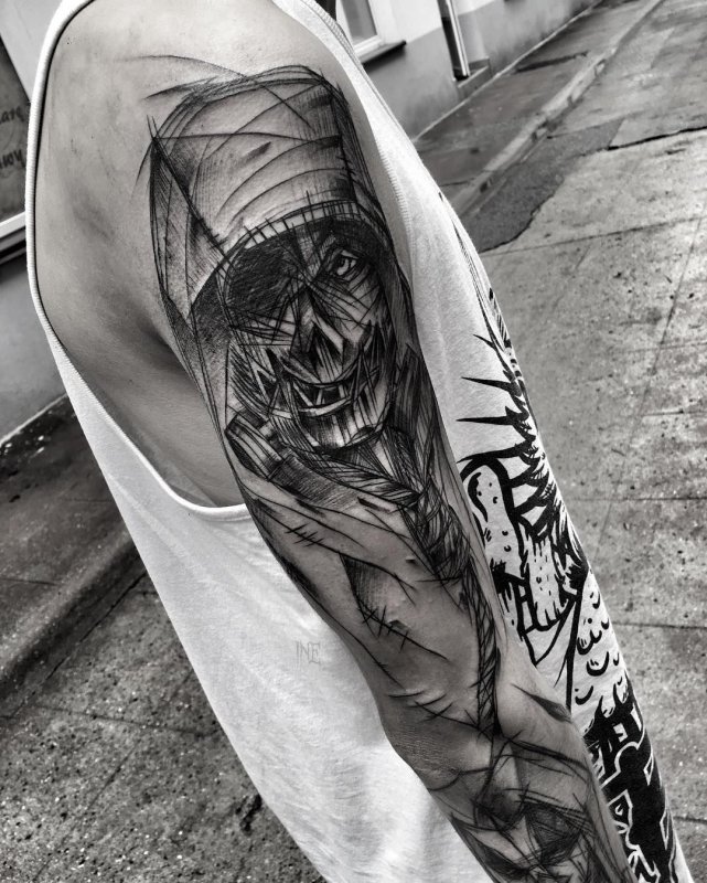 Large sketch style tattoo on the arm for men