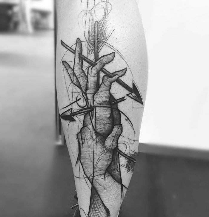 Sketch style tattoo on the calf for men