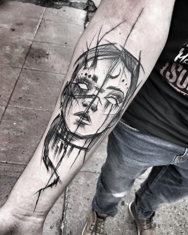 Sketch style tattoo on forearm for men