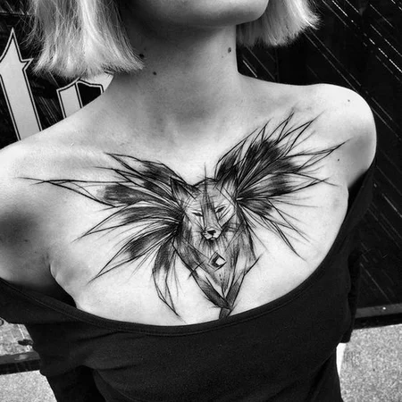 Sketch style tattoo on chest for women