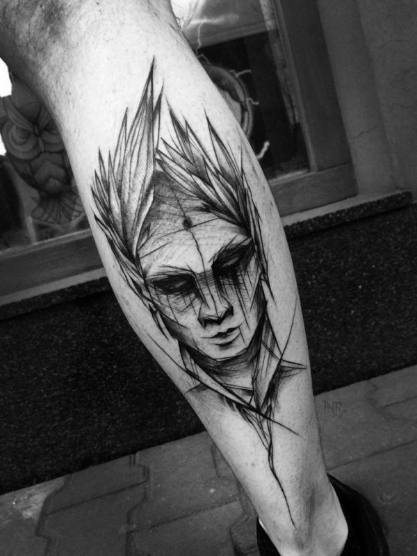 Sketch style tattoo on the calf for men