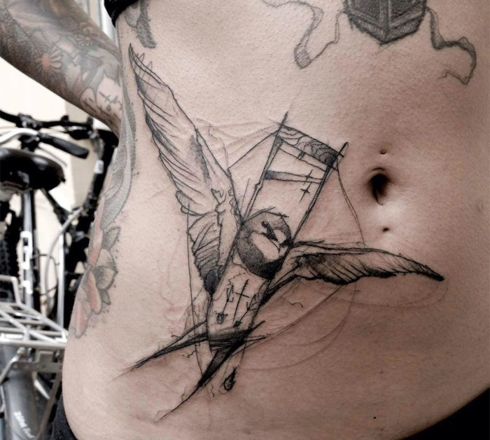 Sketch style tattoo on abdomen for men