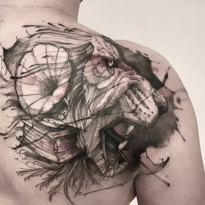 Sketch style tattoo on the shoulder blade for men