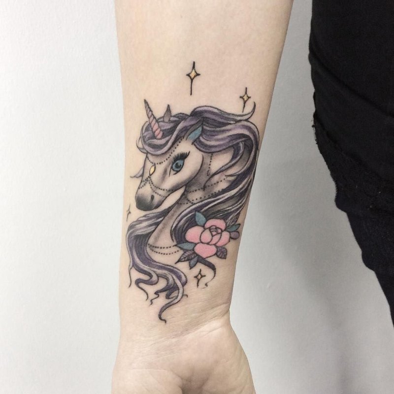 Unicorn tattoo on forearm for women