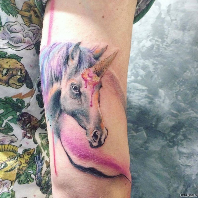 Unicorn tattoo on shoulder for women