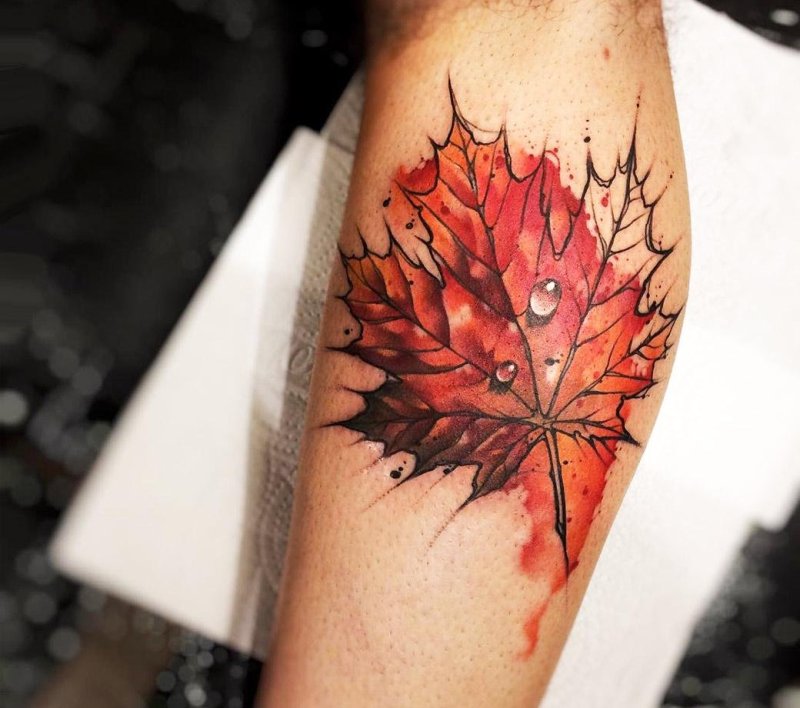 Maple leaf tattoo on leg for men