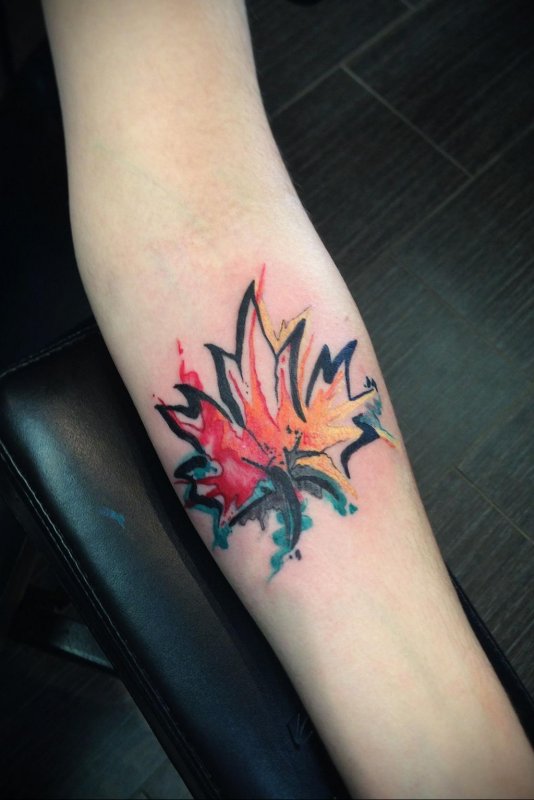 Maple leaf tattoo on forearm for women