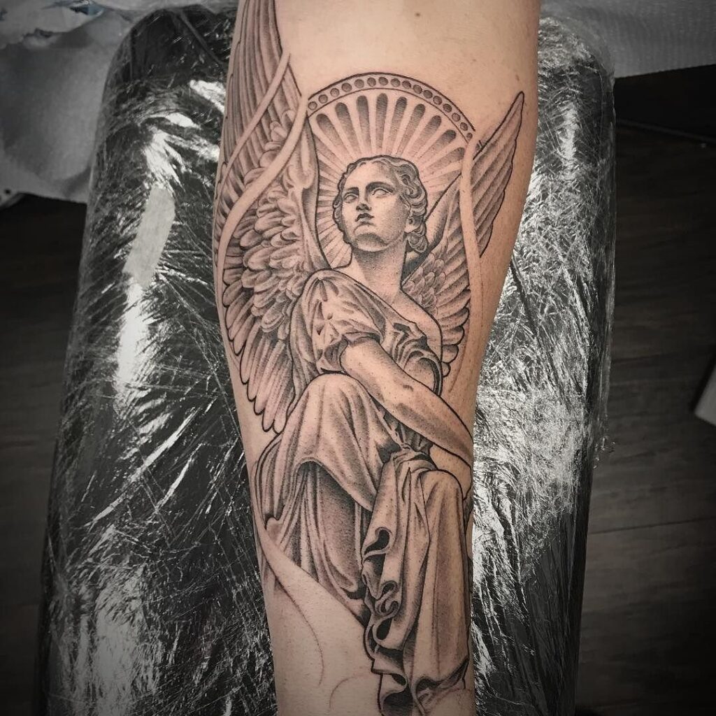 Large angel tattoo on forearm for women