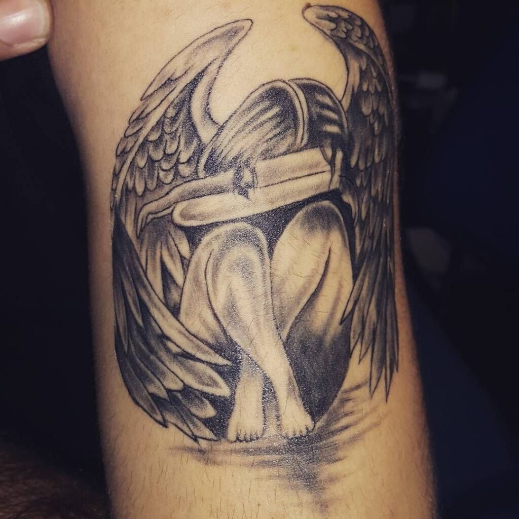 Angel tattoo on the arm for men