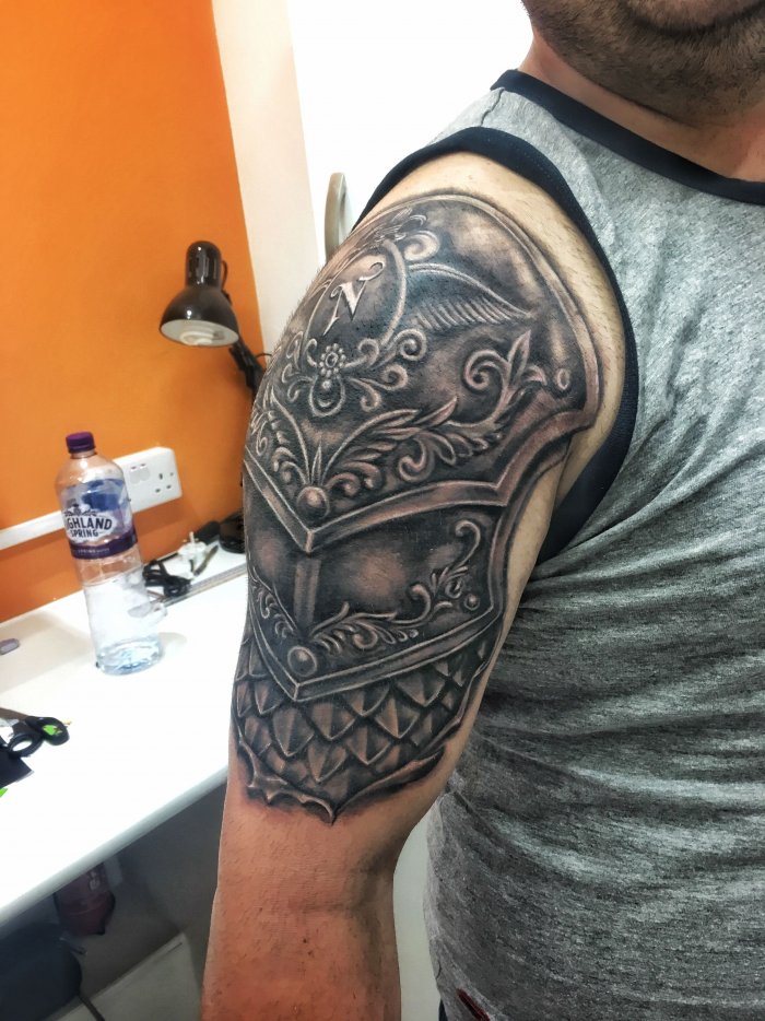 Armor tattoo on shoulder for men