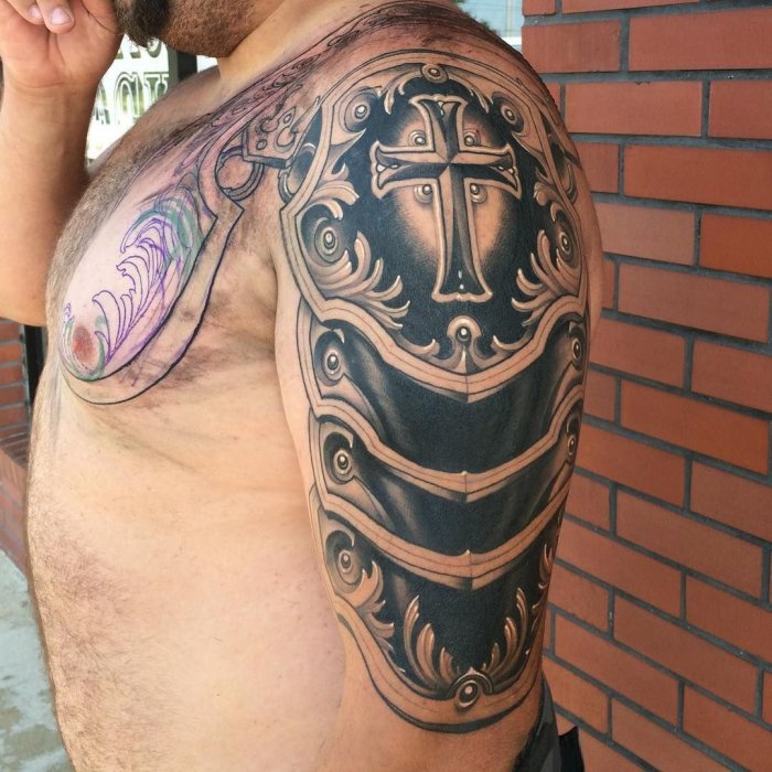 Armor tattoo on shoulder for men