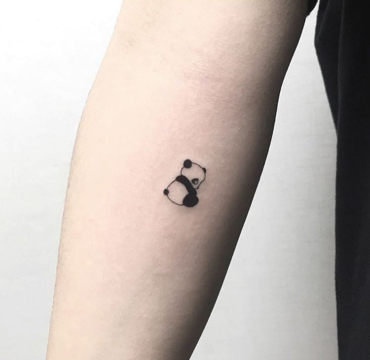 Small minimalist style tattoo on the forearm for women